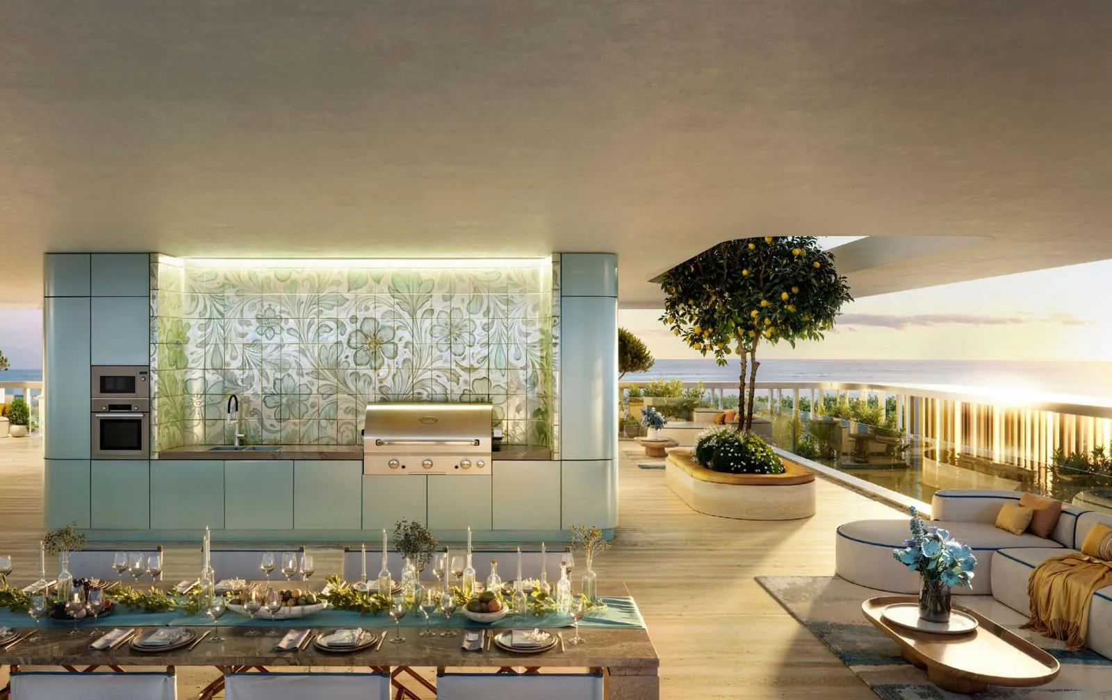An outdoor kitchen with a patterned tiled splashback and a long dining table set under the canopy