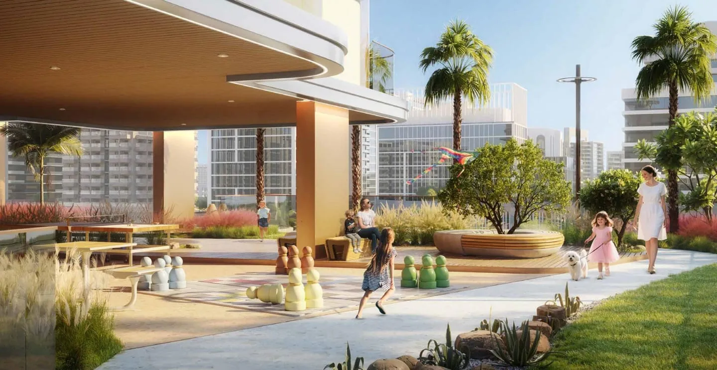The ground level plaza, outdoor tables under the building's overhang with palms and lawn in front