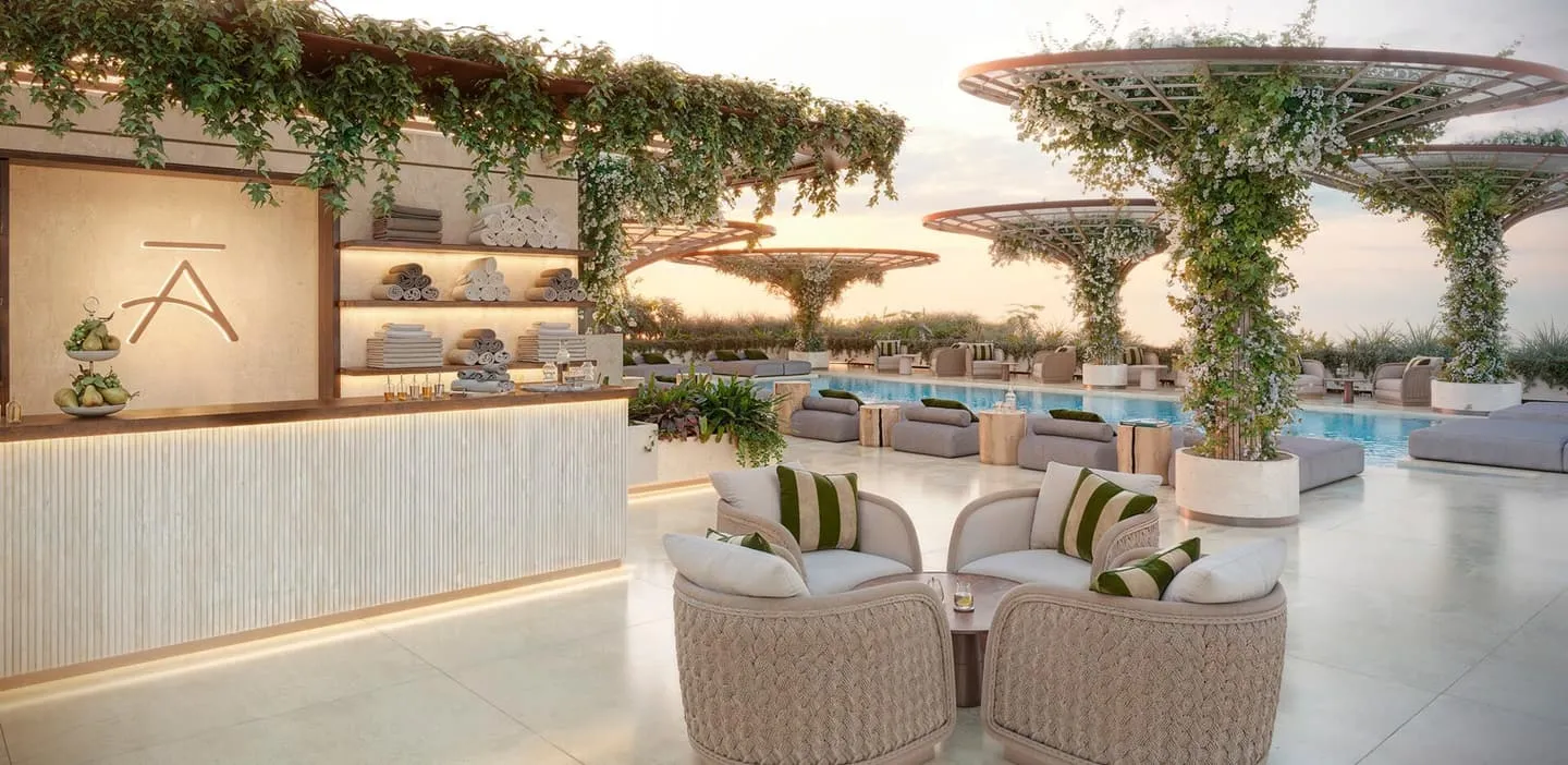 The poolside lounge, armchairs and a stone counter set beneath the canopies
