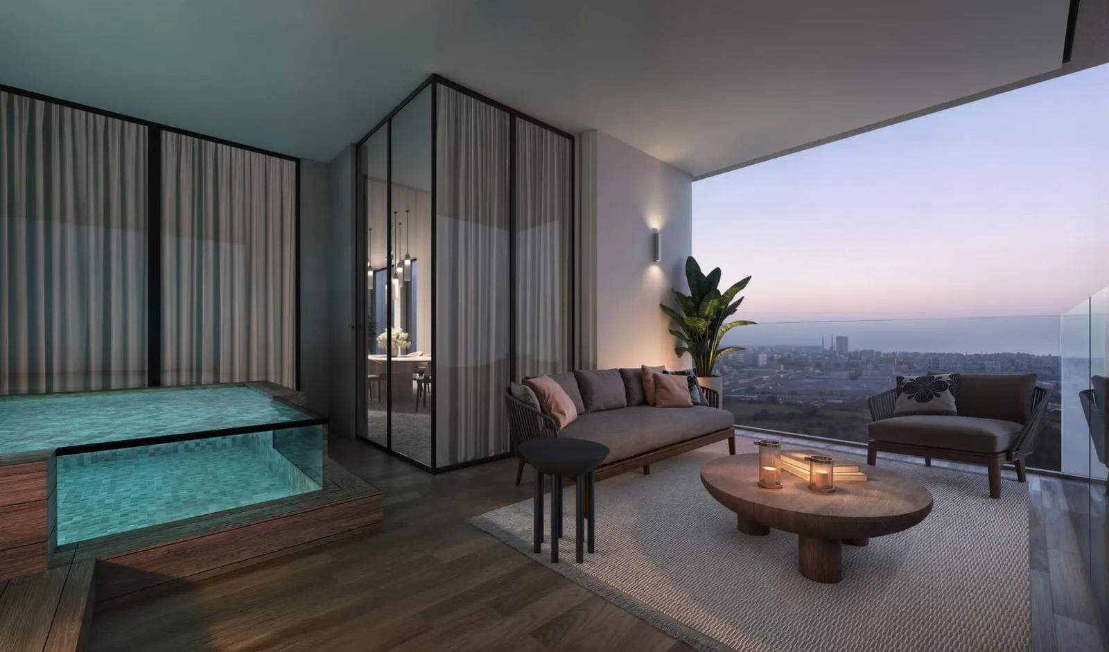 A seating area beside the pool at dusk, a low table between the chairs and the water reflecting the glass wall