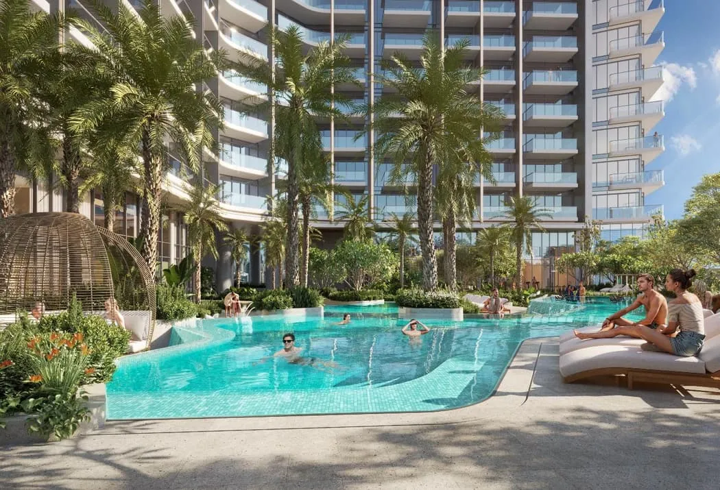 Render of the pool with swimmers, loungers and palm trees below the tower