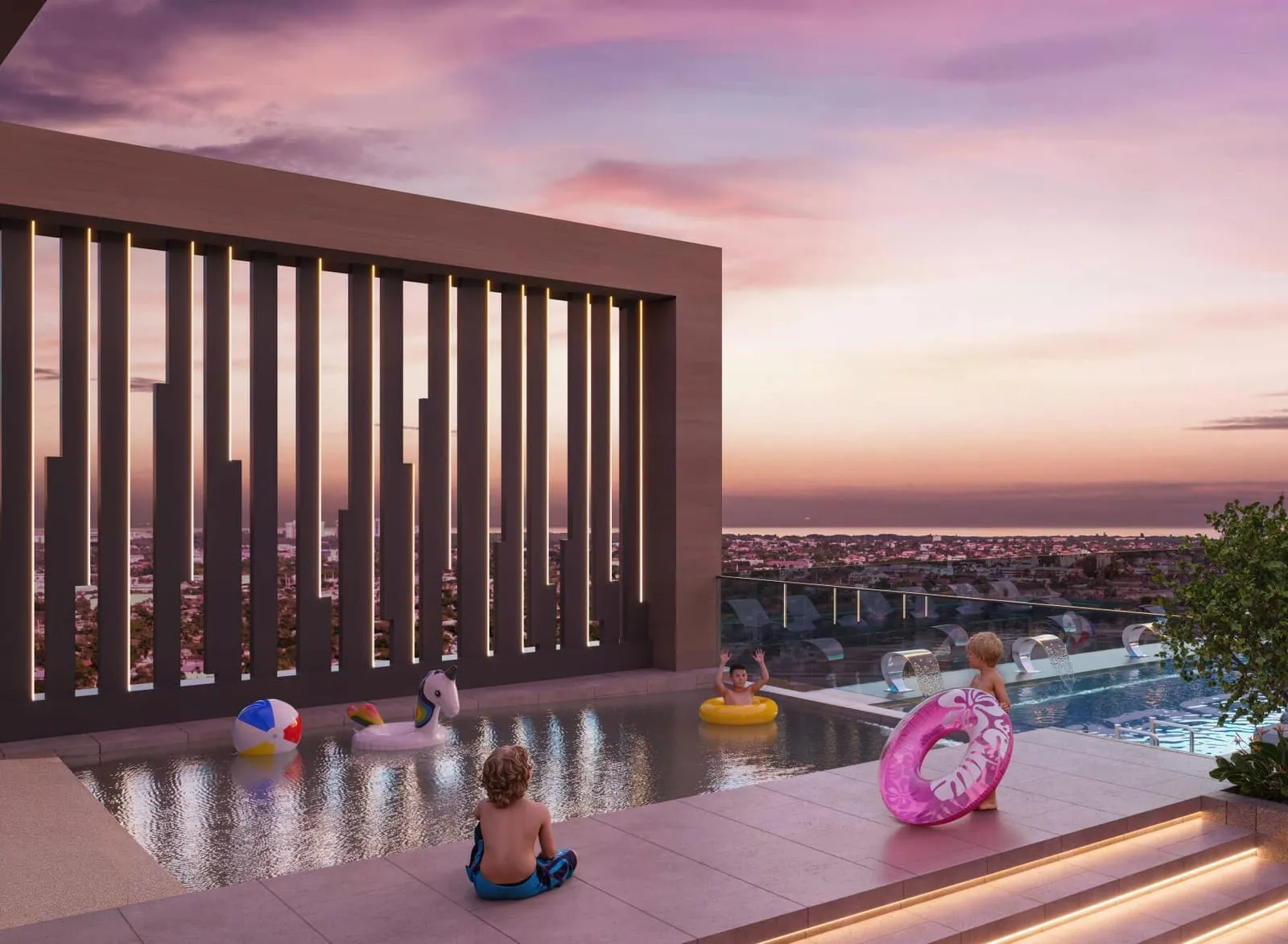 Children playing with floats in the shallow end of the rooftop pool under a pink sunset sky