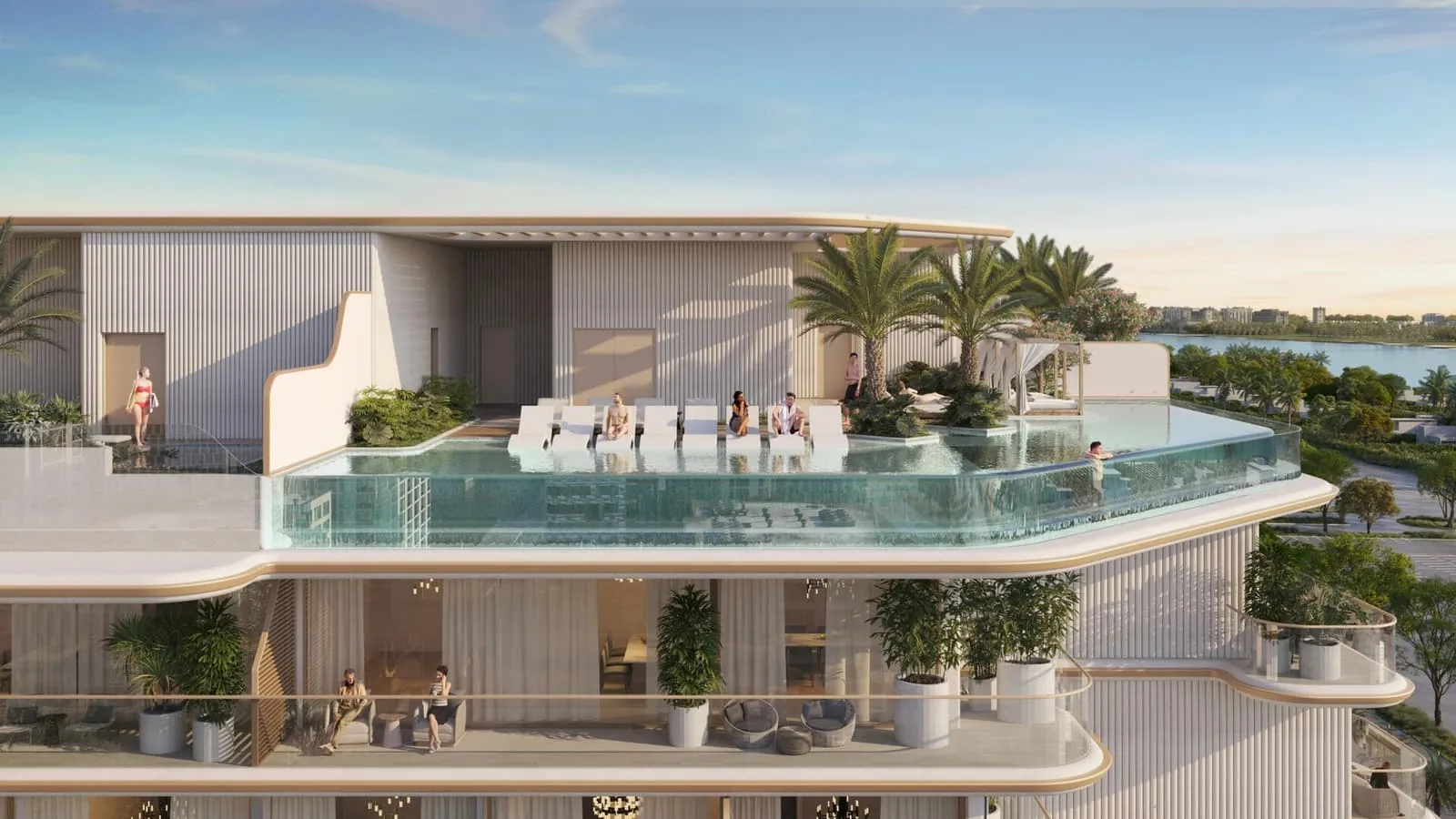 The rooftop pool at dusk, its edge running out to the horizon between palms and lit lounge seating