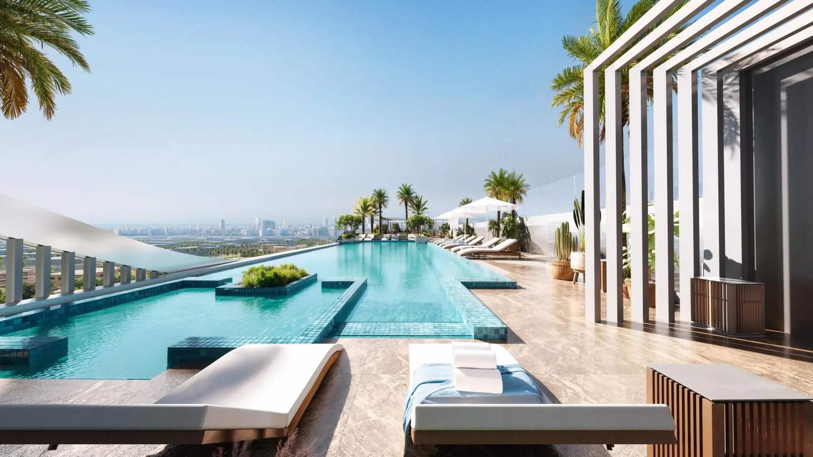 Rooftop swimming pool and sun loungers with the Dubai skyline in the background.