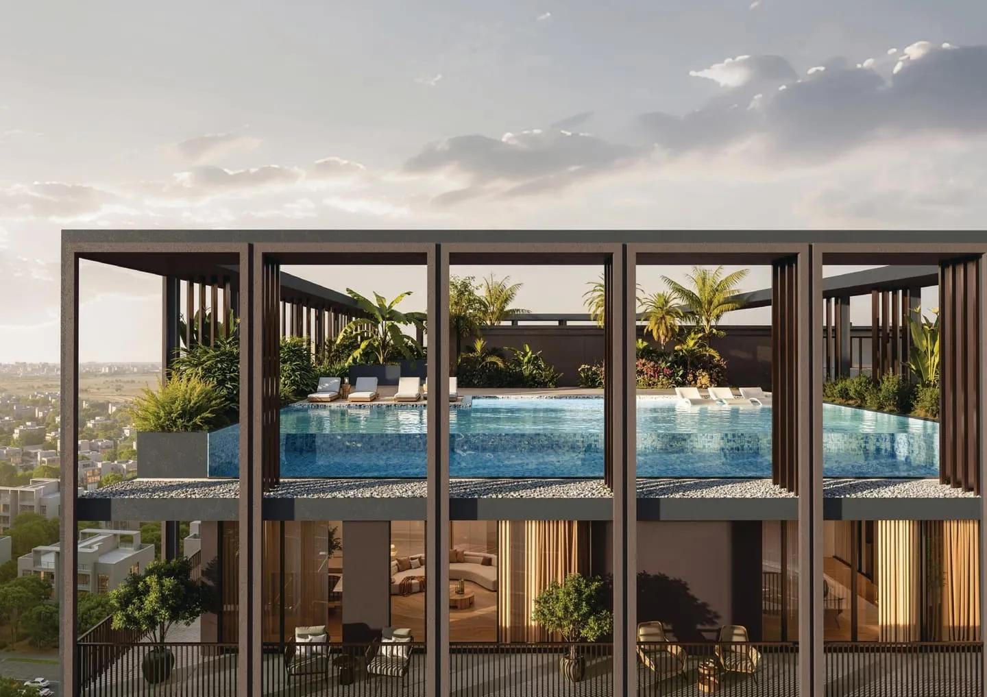 A pool on the roof framed by the building's bronze structure, planting along its far edge