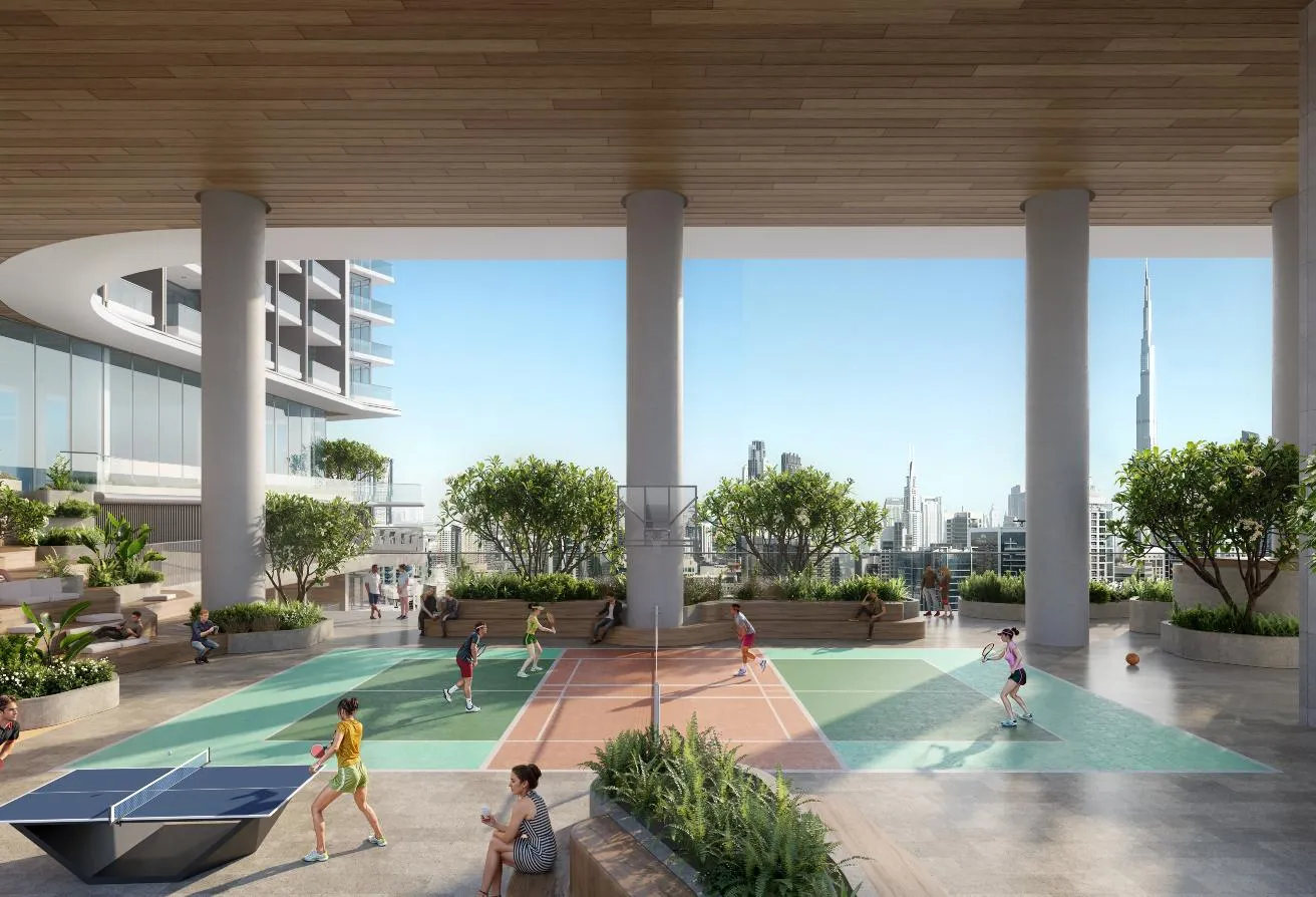 Render of a covered sports deck with two courts and a table-tennis table, the city beyond