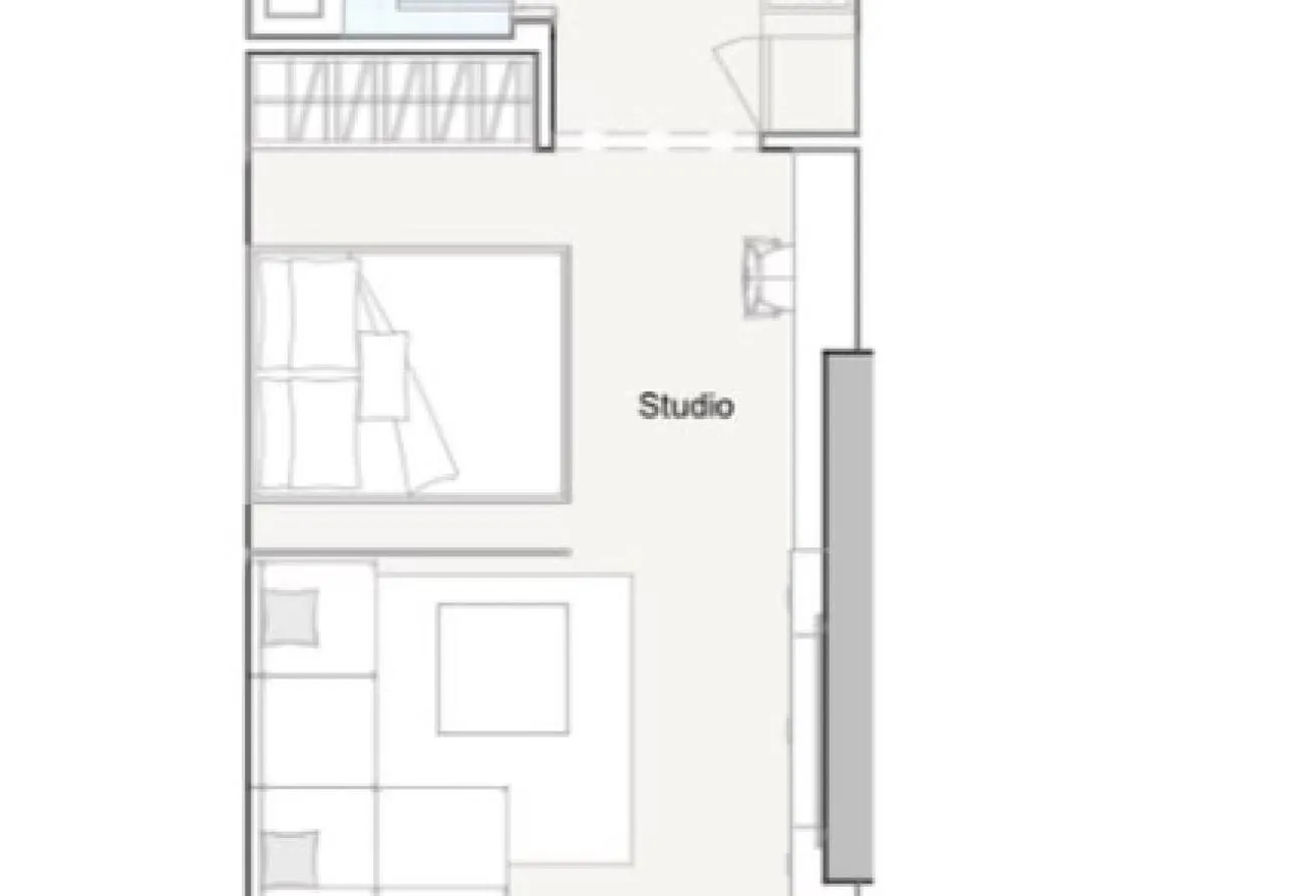 Floor plan of the studio, with the bed and wardrobes beside a sitting area