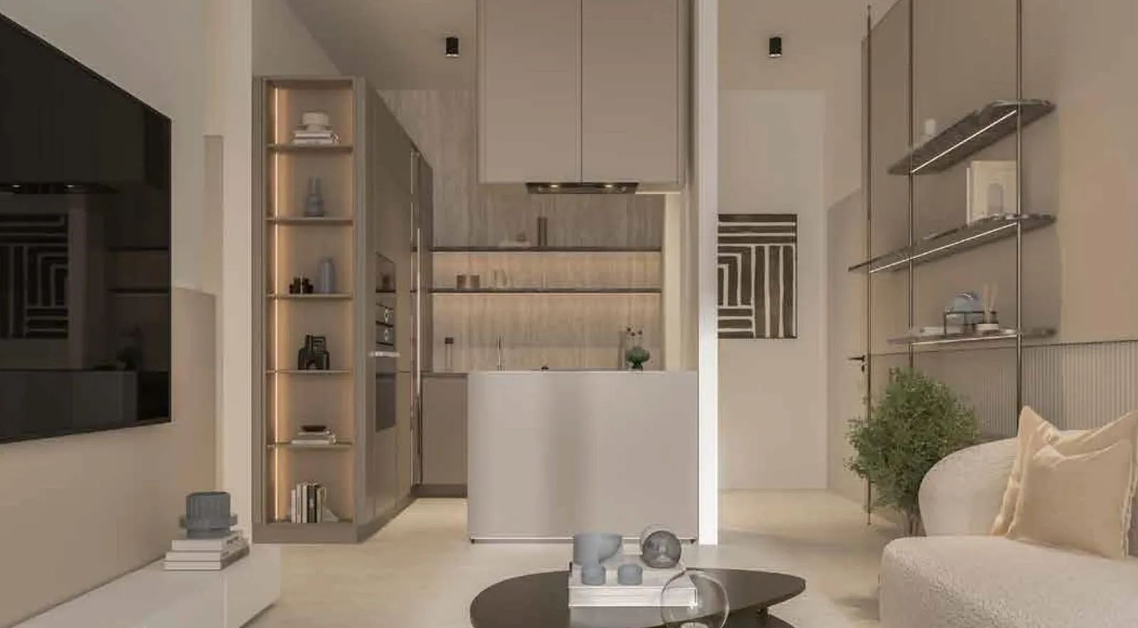 A studio interior with a compact kitchenette, open shelving and a small dining table beside the seating area