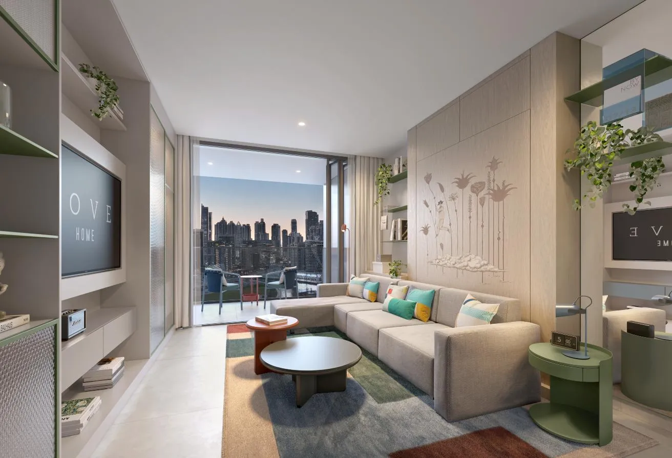 Render of the studio with an L-shaped sofa and a round coffee table by the window