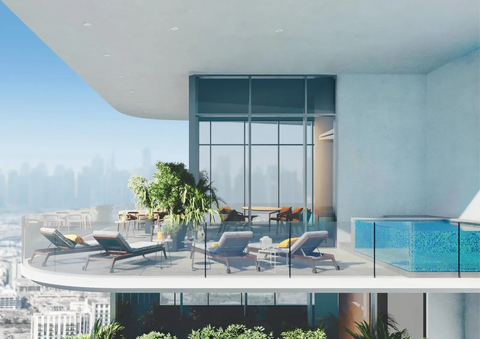 A private terrace with a plunge pool at its edge, sun loungers and planting under a deep white soffit