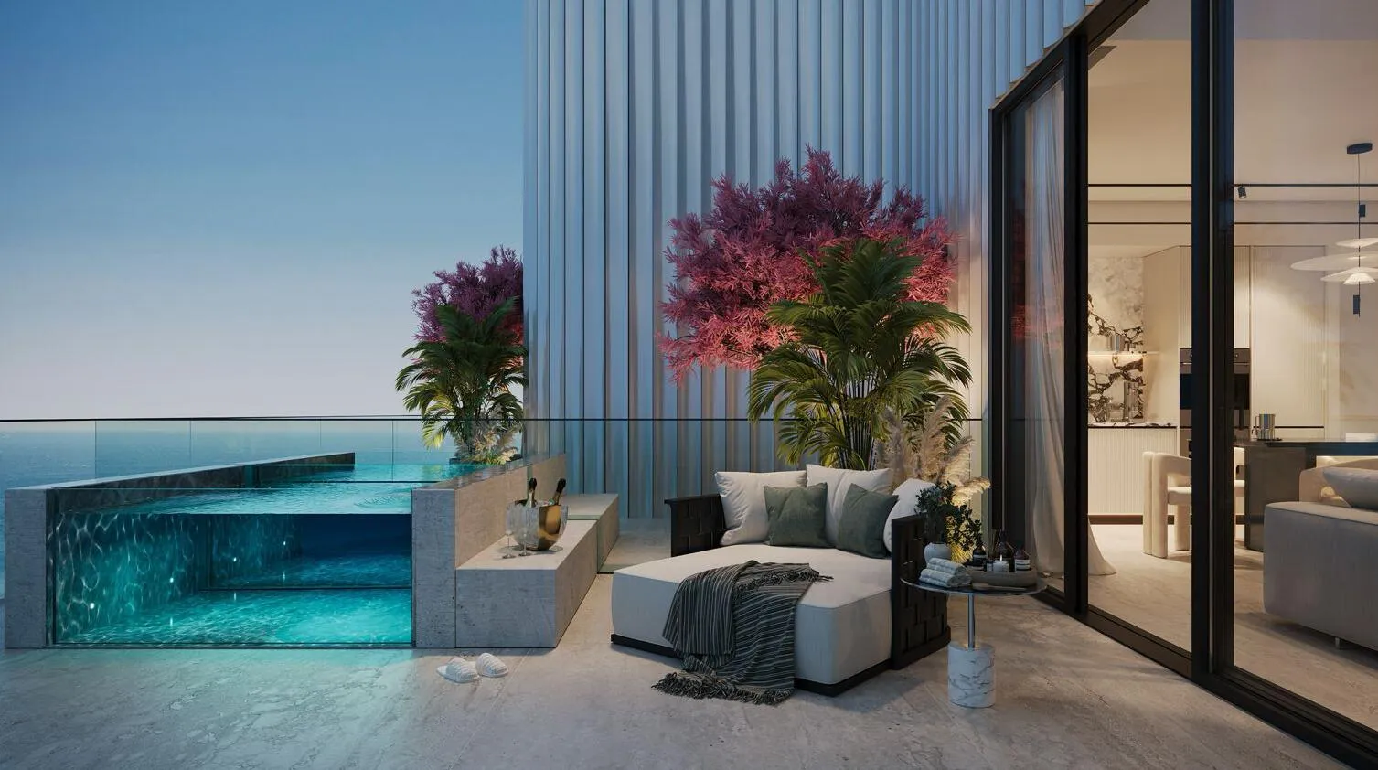 A private terrace pool with a glass side wall, lit blue at dusk beside planters of bougainvillea and an outdoor lounge