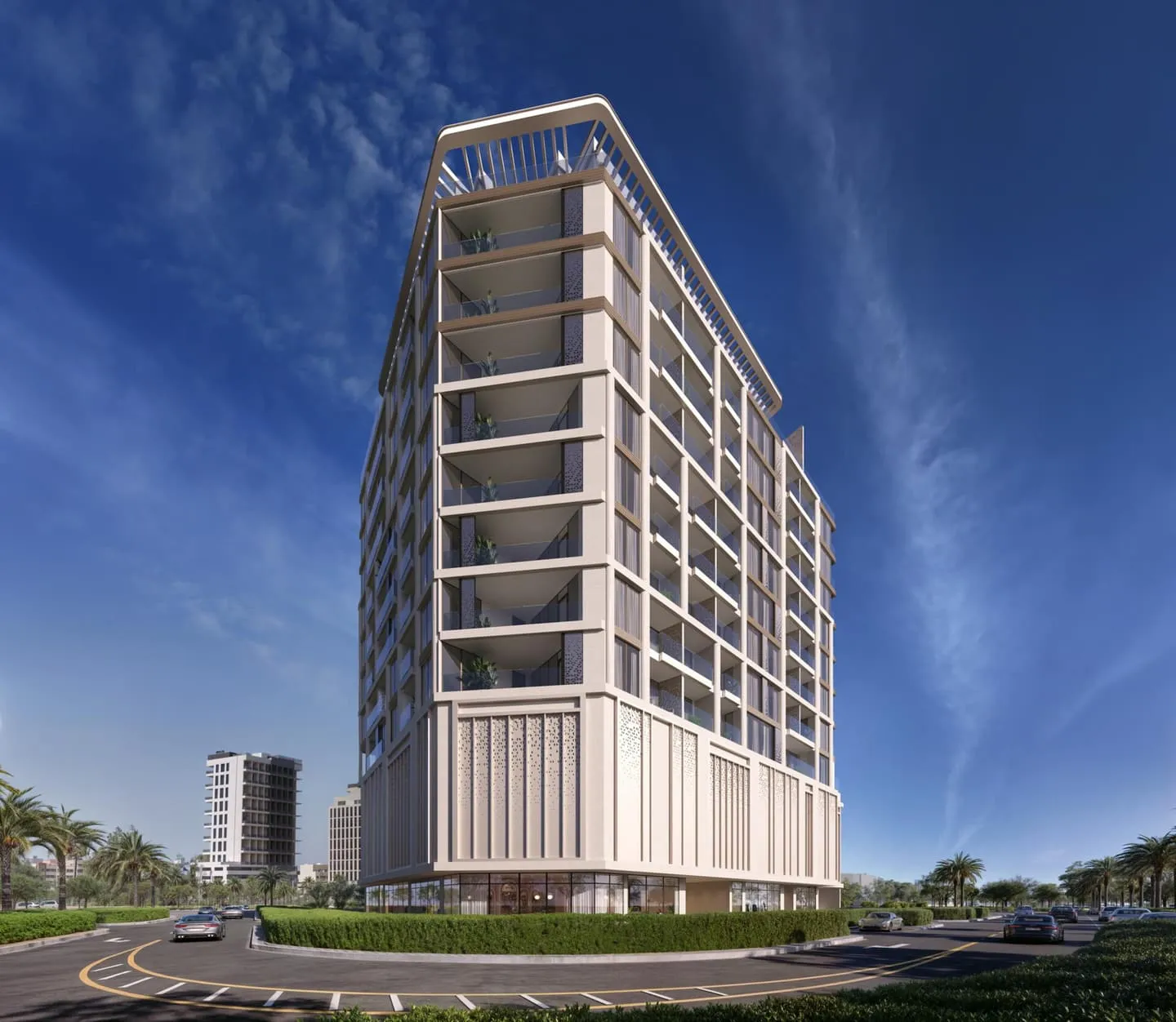The tower from the road corner in daylight, deep white balcony frames stacked above a fluted podium screen under a streaked sky