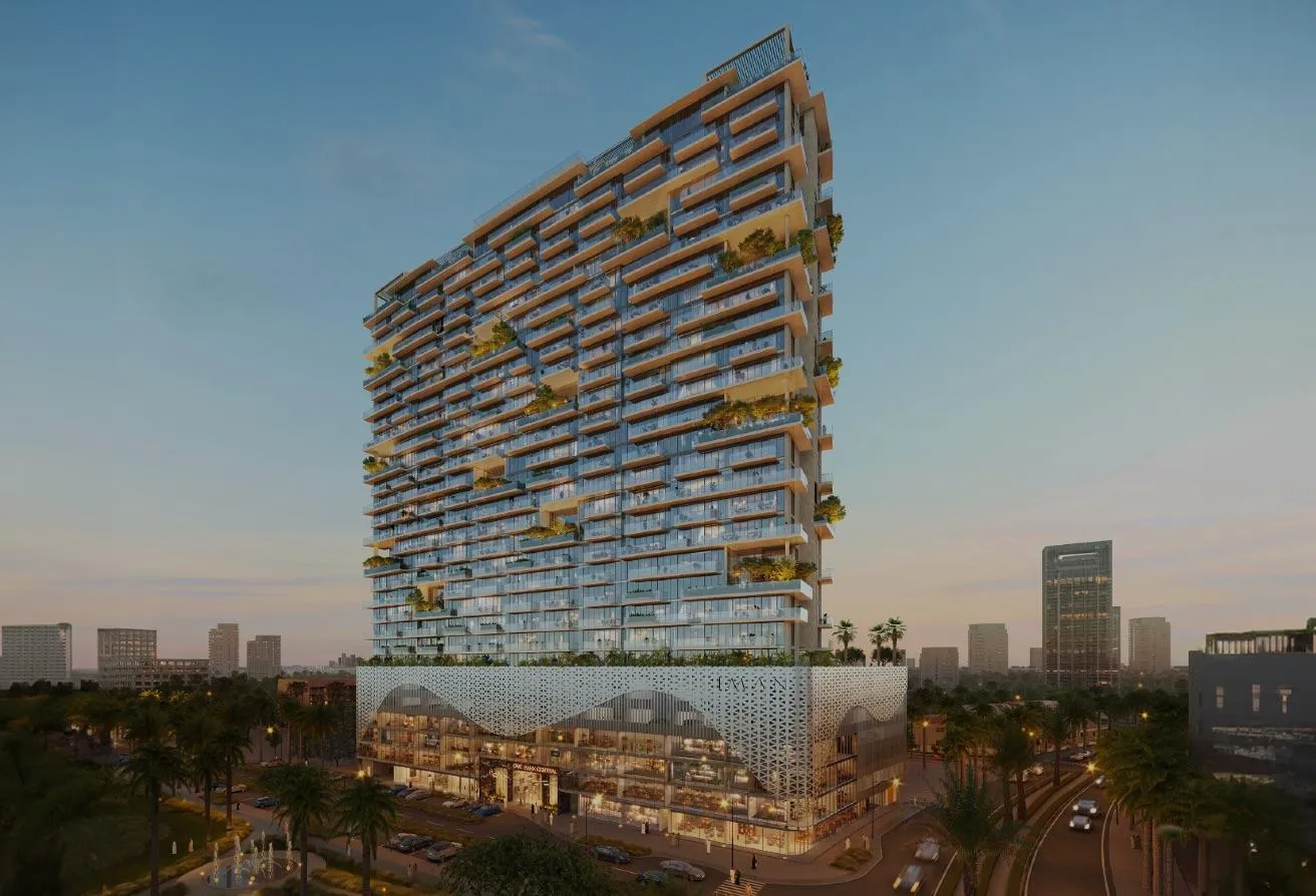 Render of the One Park Central tower at dusk, its balconies planted with greenery above a lit podium