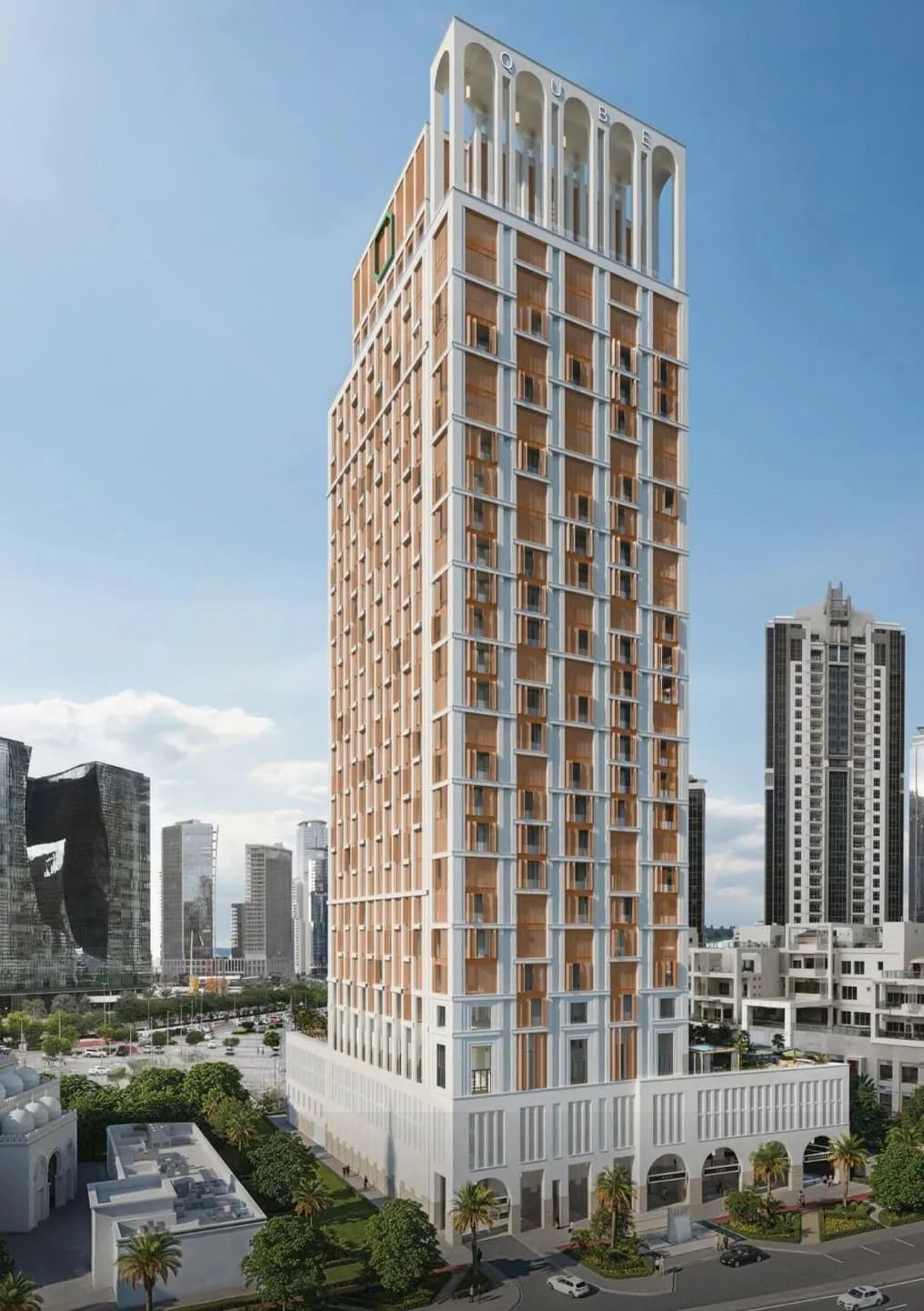 The tower seen from street level, its ribbed facade rising against a clear sky above the neighbouring blocks
