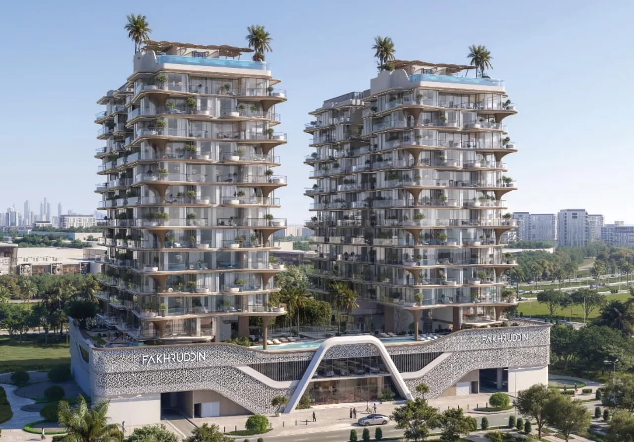 Treppan Serenique Residences' twin towers rising above landscaped gardens on Dubai Islands in daylight.