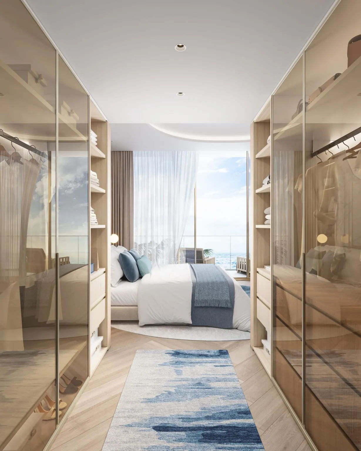 The passage into the bedroom lined with bronze glass wardrobe doors, a blue runner along the floor